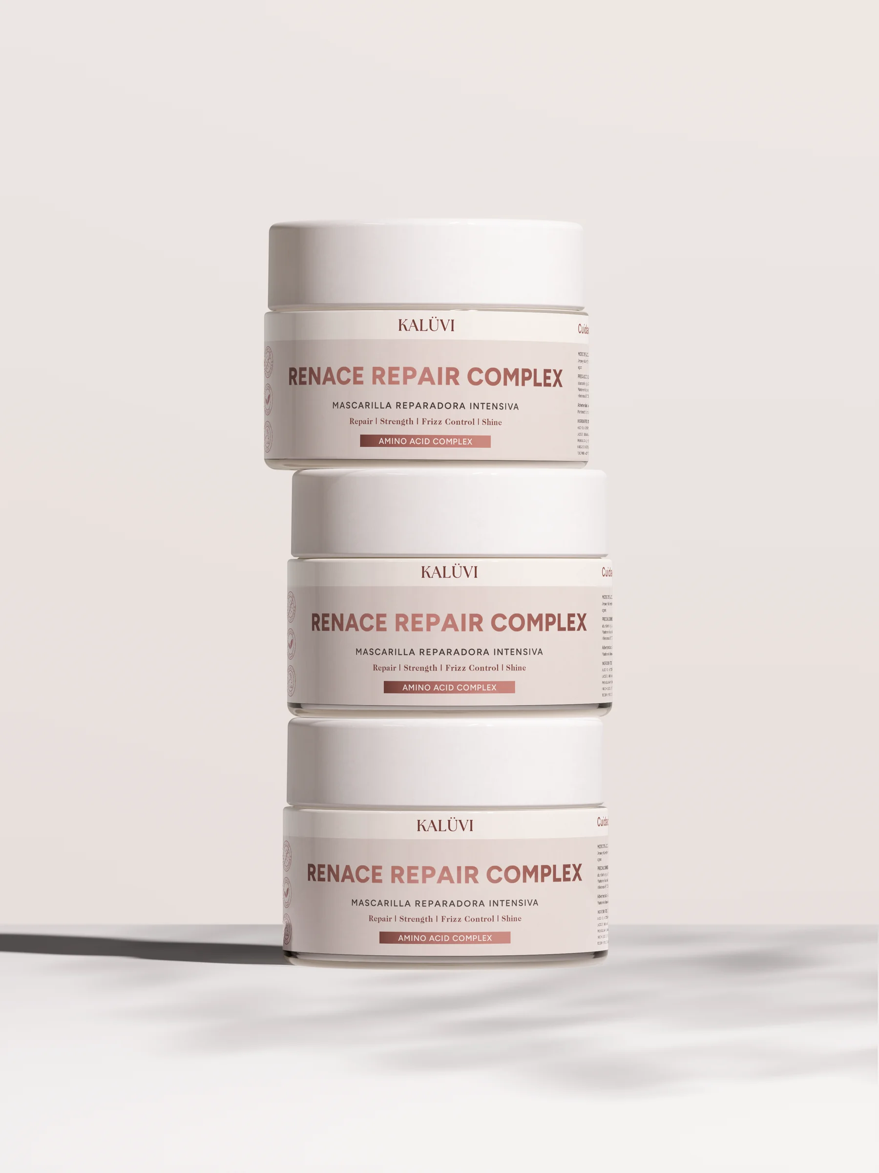 Tre staplade Kalüvi-burkar med hårinpackningen Renace Repair Complex